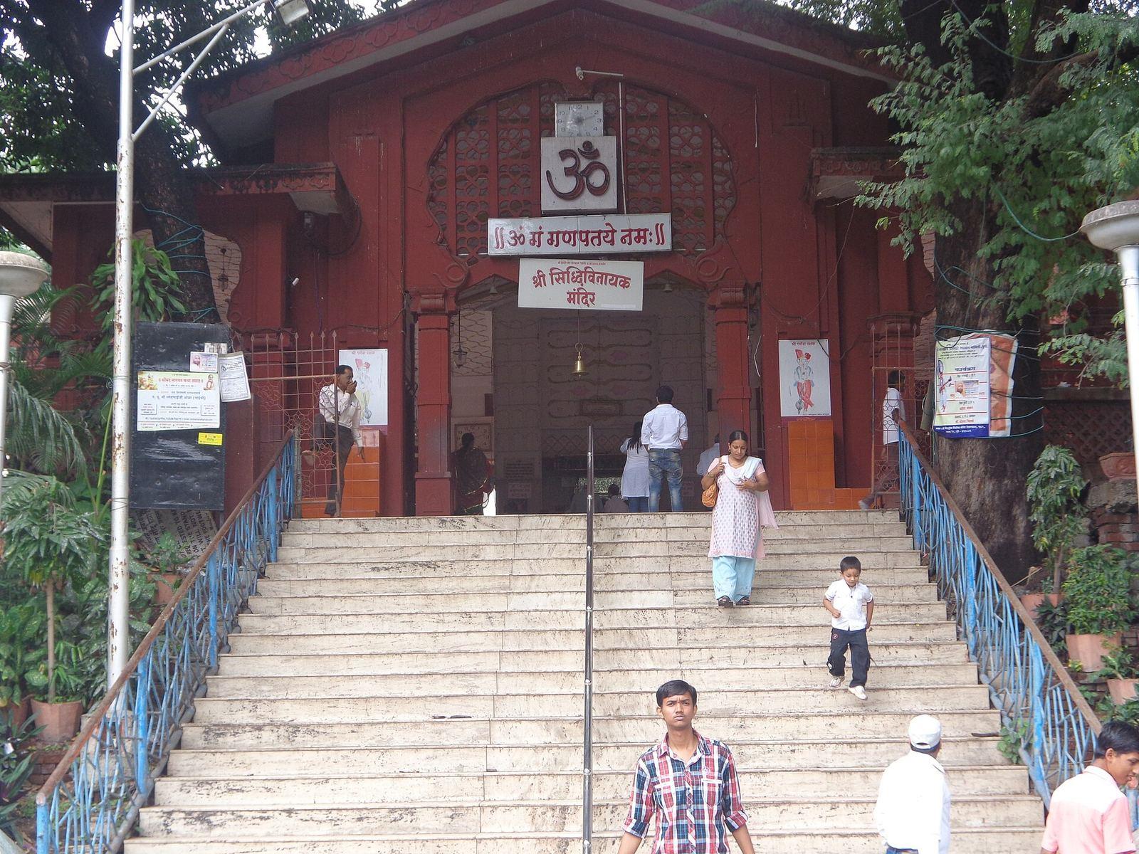 Shri Siddhivinayak temple in Sarasbaug, Pune, a white building with a spire among trees
